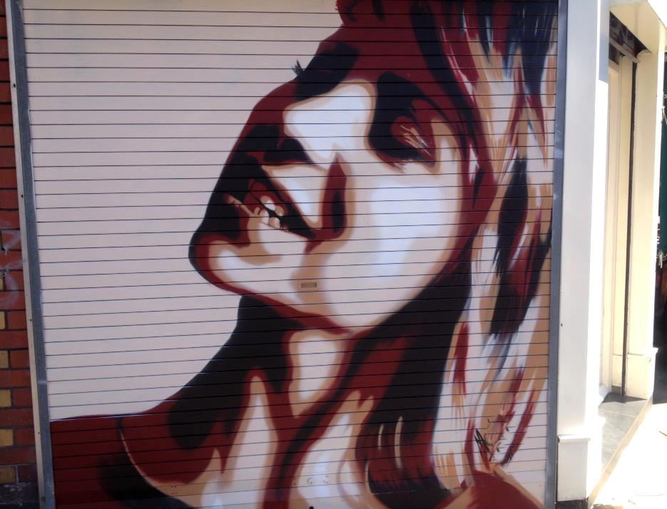 Image of girls face painted on shot shutter